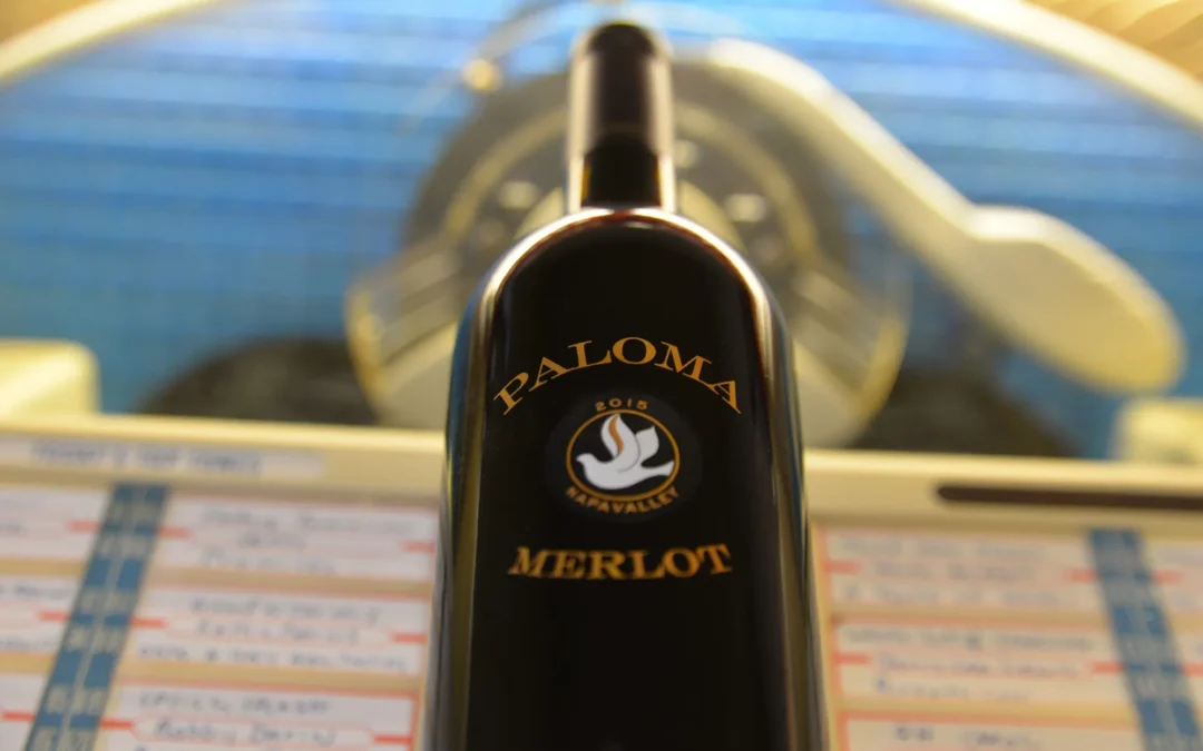 Paloma merlot bottle in front of radio